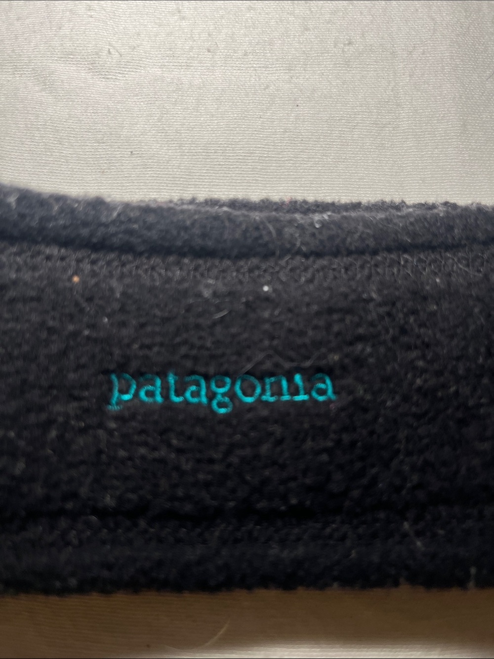 Patagonia Black Fleece Headband with Teal Logo